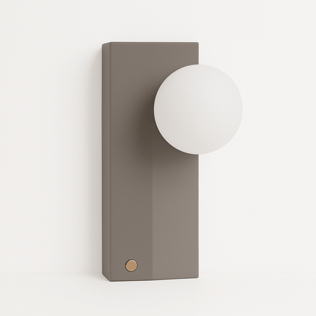 Teral Table Lamp with matte concrete base and frosted glass globe, ideal for modern ambient lighting in bedrooms or living rooms.