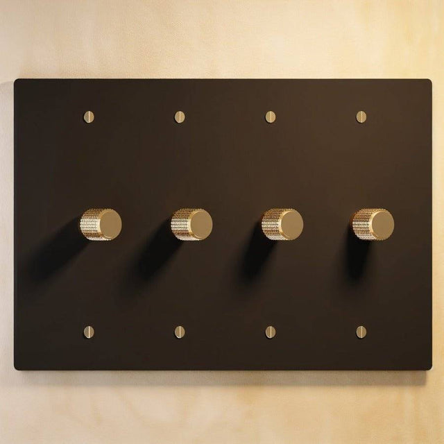 Four-gang black brass rotary dimmer switch with gold detailing, part of The Brass 3-Way Rotary Dimmer Switch Open Box collection.