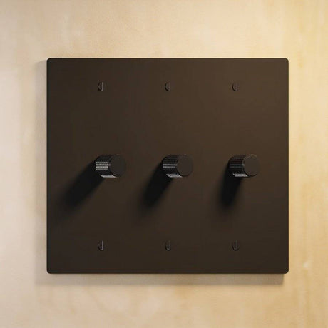 Three-gang matte black rotary dimmer switch with uniform black knobs, part of The Brass 3-Way Rotary Dimmer Switch Open Box line.