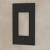 Black decorative outlet wall plate with rounded corners and mounting holes