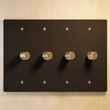 Four-gang The Brass Dimmer Switch - Open Box in matte black and brass, offering sleek multi-light control.
