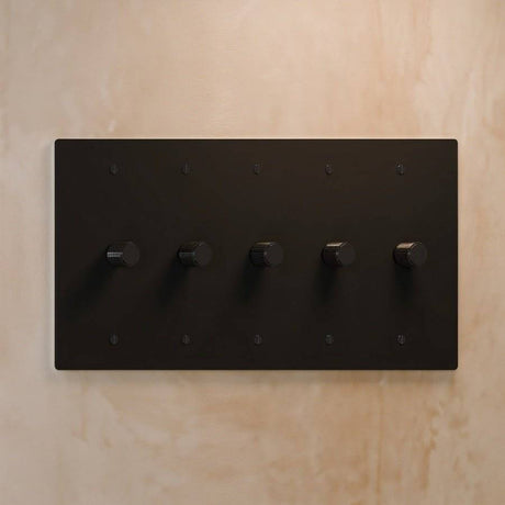 Five-gang The Brass Dimmer Switch - Open Box in matte black, designed for high-end lighting in large spaces.