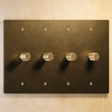Four-gang The Brass Dimmer Switch - Open Box in dark brass, offering elegant multi-zone lighting control.