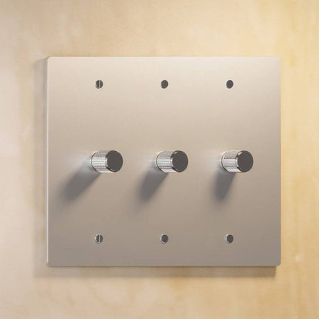 Three-gang silver The Brass Dimmer Switch - Open Box with metallic finish, offering precise lighting control.
