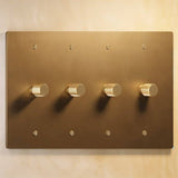 Four-gang The Brass Dimmer Switch - Open Box with a sleek brass finish, designed for stylish multi-light control.