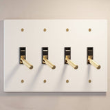 Four-gang The Brass Toggle Switch (1 to 5 Gang) - Open Box in white with gold toggles, ideal for modern and minimalist lighting setups.