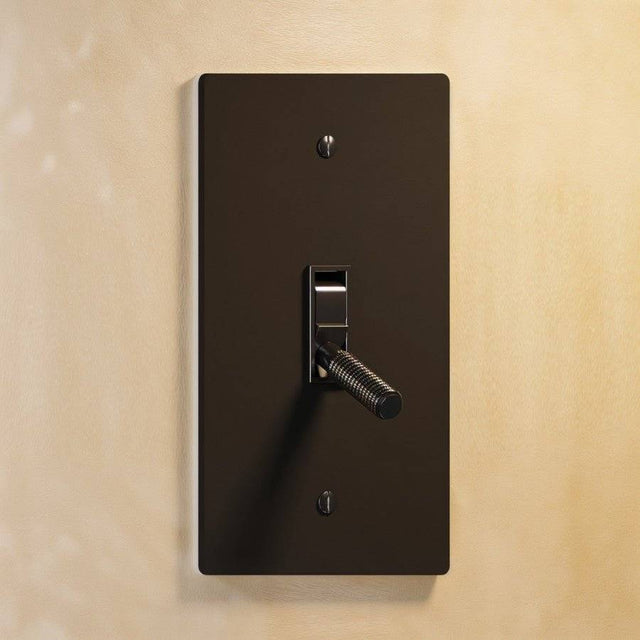 Single gang The Brass Toggle Switch (1 to 5 Gang) - Open Box in dark bronze with knurled toggle, blending vintage and modern aesthetics.