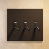 Triple gang The Brass Toggle Switch (1 to 5 Gang) - Open Box in antique bronze with gold toggles, ideal for traditional home lighting.