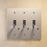 Triple gang The Brass Toggle Switch (1 to 5 Gang) - Open Box in brushed nickel with silver toggles, perfect for modern home lighting.