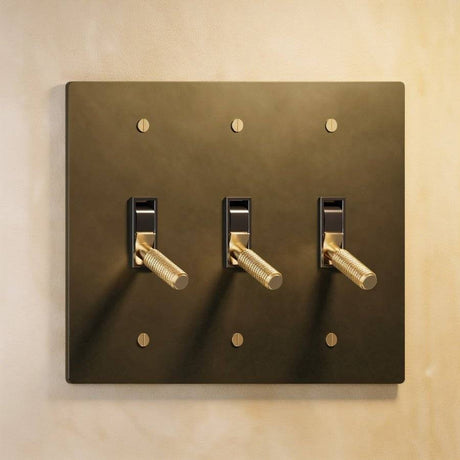 Triple gang The Brass Toggle Switch (1 to 5 Gang) - Open Box in antique brass, offering tactile lighting control with a vintage touch.