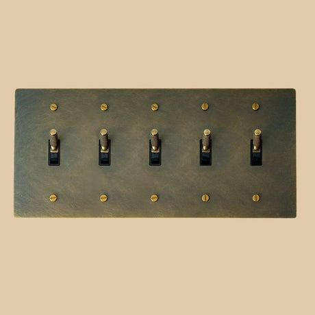 Five-gang The Brass Toggle Switch (1 to 5 Gang) - Open Box in vintage brass with knurled toggles, perfect for expansive heritage lighting setups.