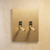 Double gang The Brass Toggle Switch (1 to 5 Gang) - Open Box in satin brass, offering dual toggle control for refined lighting design.