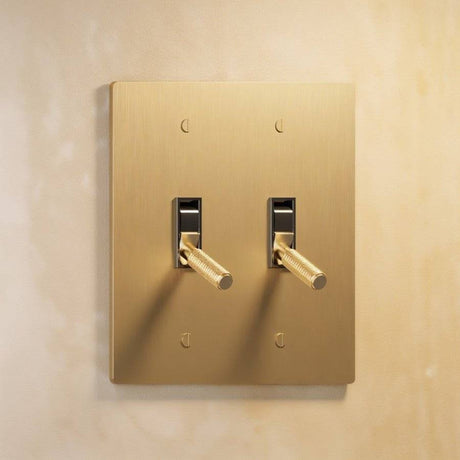 Double gang The Brass Toggle Switch (1 to 5 Gang) - Open Box in satin brass, offering dual toggle control for refined lighting design.
