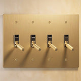 Four-gang The Brass Toggle Switch (1 to 5 Gang) - Open Box in satin brass finish, offering elegant multi-light control for contemporary interiors.