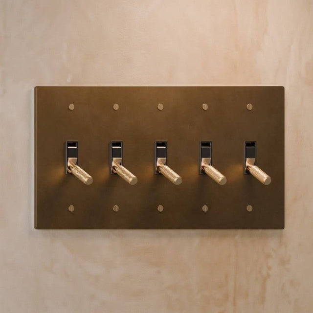 Five-gang version of The Brass Toggle Switch (1 to 5 Gang) - Open Box in polished brass, designed for large spaces with multiple lighting zones.