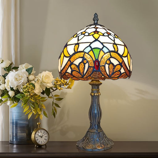 Tiffany Rose Blossom Table Lamp: Adorned with intricate stained glass panels depicting vibrant rose blossoms, this table lamp brings a touch of nature's beauty into your home.