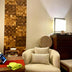 Wooden wall panel with mixed grain finish in warm brown tones installed in modern interior design setting.