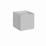 "Tine Wall Lamp product shot showcasing its minimalist geometric design, crafted from gypsum and aluminum, highlighting the sleek square shape."