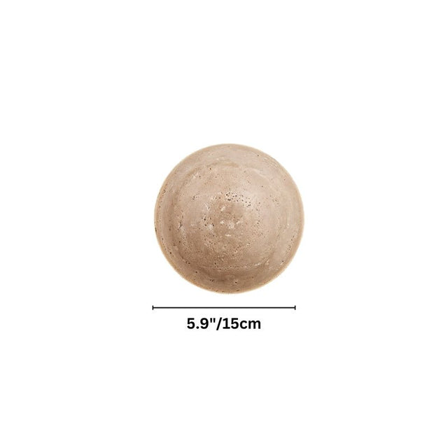 "Dimensions of a spherical travertine wall lamp, showing a diameter of 5.9 inches."