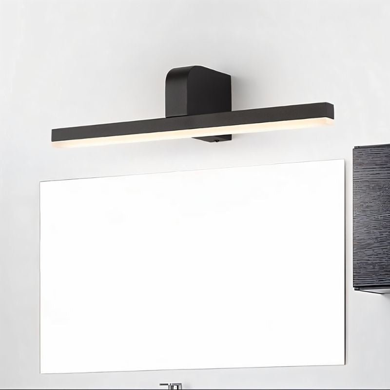 "A modern, dark finish LED vanity light mounted above a bathroom mirror."