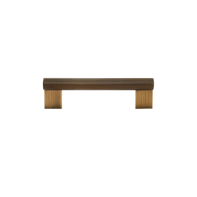 "Full view of a modern antique brass pull bar with a sleek ribbed texture, ideal for cabinet doors, drawers, and wardrobe panels."