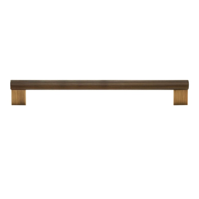 "A modern antique brass pull bar with a sleek ribbed texture, ideal for cabinet doors, drawers, and wardrobe panels in modern and transitional interiors."