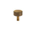 "A modern brass knob with a sleek ribbed texture, suitable for cabinet doors and drawers in modern and transitional interiors."