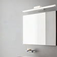 "Modern wall lamp providing uniform illumination above a bathroom vanity mirror."