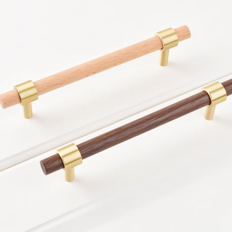 "light and dark wood pull bars with brass accents arranged side by side, minimalist design."