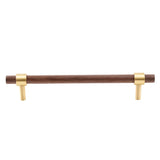 "Dark wood and brass pull bar with cylindrical design, isolated on a white background."