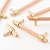 "light wood pull bars with brass accents, perfect for contemporary cabinets and drawers."