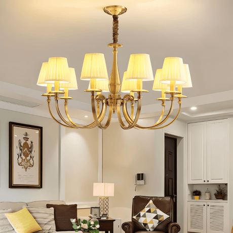 Uloma Chandelier – Elegant Lighting For Luxe Interiors illuminating a cozy living room with traditional furniture and ambient lighting.