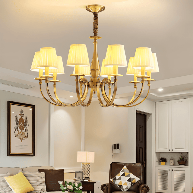Uloma Chandelier – Elegant Lighting For Luxe Interiors illuminating a cozy living room with traditional furniture and ambient lighting.