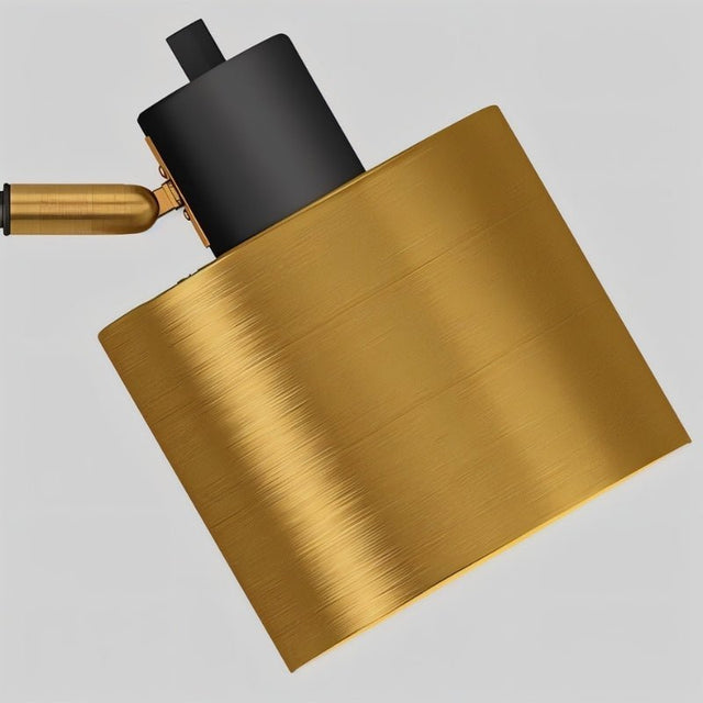 "Close-up view of the adjustable cylindrical gold shade, crafted from durable iron with a sleek brushed finish, part of a modern floor lamp design"
