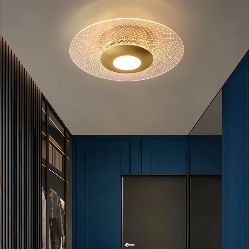 "A patterned ceiling light with a modern design, providing ambient illumination in a contemporary space."