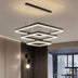 Modern black metal pendant chandelier with nested square frames and integrated LED lighting suspended in contemporary interior space.