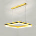 Modern square pendant light with brass finish and integrated LED strip suspended from ceiling.