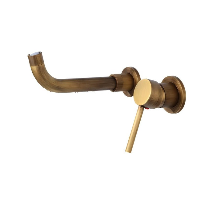 Antique brass Vartay Bathroom Faucet with curved spout and single lever handle, wall-mounted for vintage appeal.