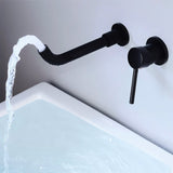 Black Vartay Bathroom Faucet with water flowing into a bathtub, showcasing its sleek wall-mounted design.