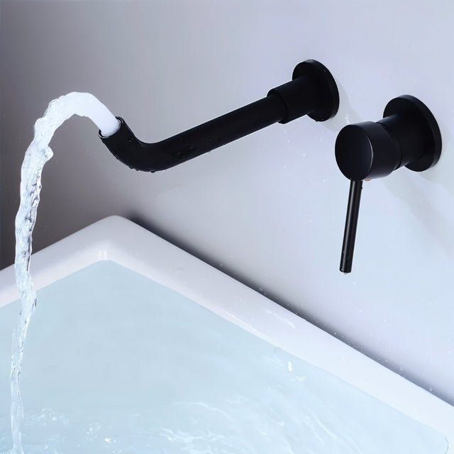 Black Vartay Bathroom Faucet with water flowing into a bathtub, showcasing its sleek wall-mounted design.