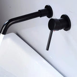 Side view of matte black Vartay Bathroom Faucet with water running, mounted above a white sink.