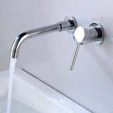 Chrome Vartay Bathroom Faucet with water flowing, wall mounted above a white basin for a sleek bathroom look.
