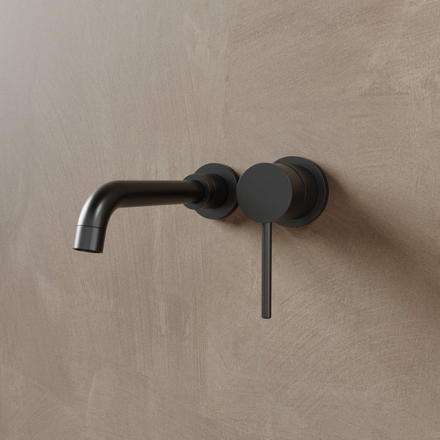 Matte black Vartay Bathroom Faucet with wall-mounted installation and modern cylindrical handle for contemporary bathrooms.