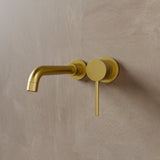 Vartay Bathroom Faucet in matte brushed gold finish, featuring a minimalist wall-mounted design with a single lever handle.