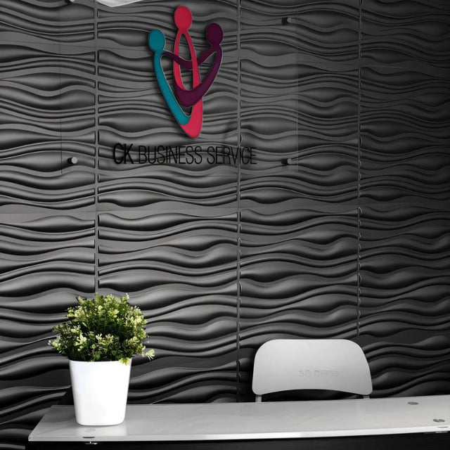 Vefni Panels - Durable, Modern Design for Any Space. Black 3D PVC wall panels with wave texture installed in a modern office reception area.