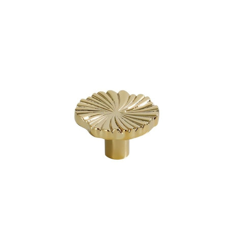 "A gold brass drawer pull with a fan-shaped design, front view on a white background."