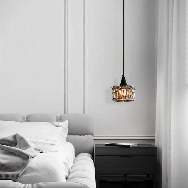 "A pendant light with a rippled glass shade in a modern bedroom interior."