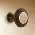 Crosshatch textured round knob with pedestal base shown from front angle against white background.