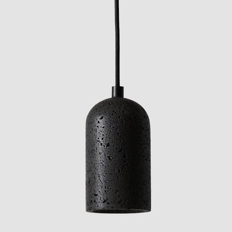 "Modern cylindrical pendant light crafted from black travertine, showcasing its natural, textured surface."