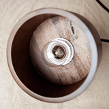 Interior view of Vesil Copper & Wood Pendant Light Fixture showing bulb socket and natural wood grain texture.